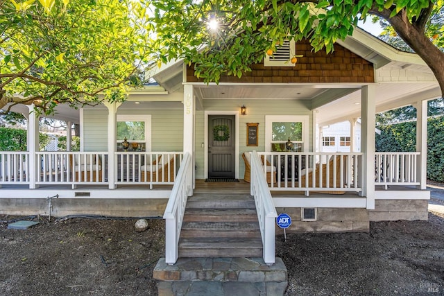 property entrance with covered porch