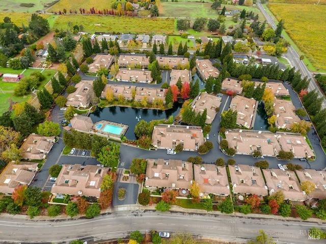 bird's eye view with a water view and a residential view