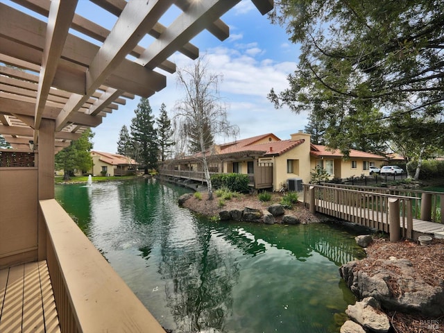 view of swimming pool featuring a water view, central AC, and a pergola