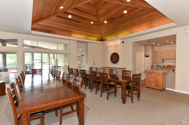 dining space with wooden ceiling, a raised ceiling, visible vents, and recessed lighting