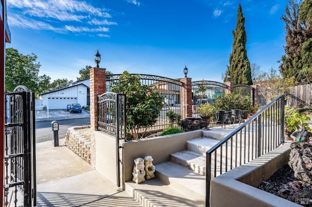 view of gate with fence