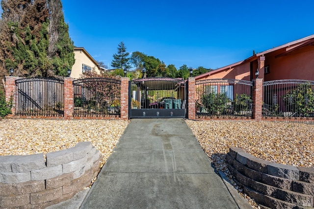 view of gate with fence