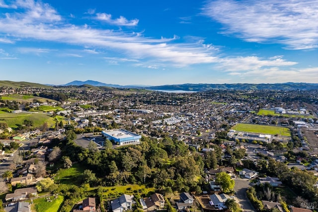 drone / aerial view featuring a residential view and a mountain view