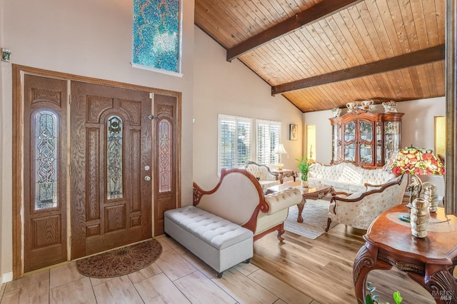 foyer featuring high vaulted ceiling, light wood-type flooring, beam ceiling, and wooden ceiling