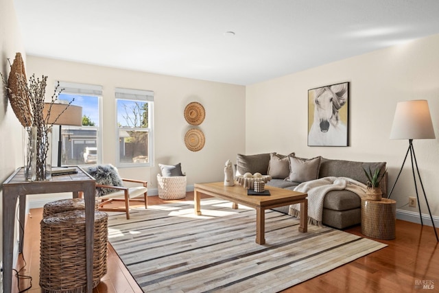 living room with wood finished floors and baseboards