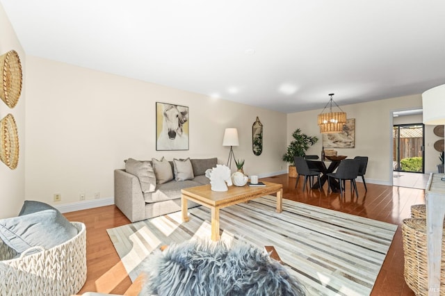 living room featuring baseboards and light wood-style floors