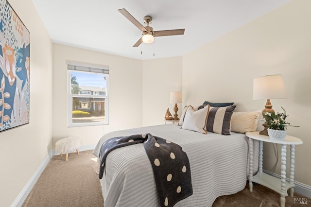 bedroom with ceiling fan, carpet flooring, and baseboards