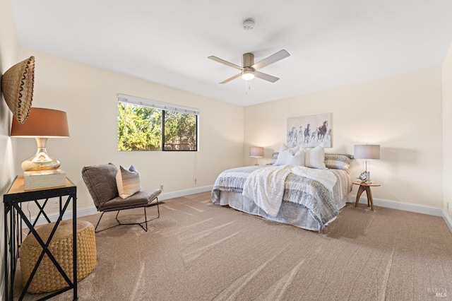 carpeted bedroom with a ceiling fan and baseboards