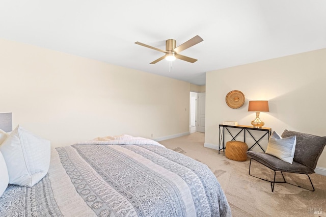 bedroom with baseboards, a ceiling fan, and light colored carpet