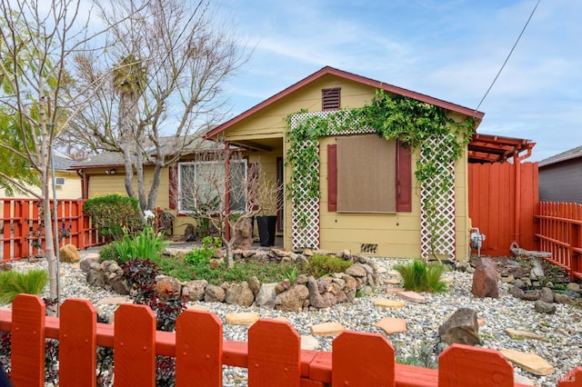 view of front of house featuring fence