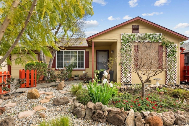 ranch-style house with fence