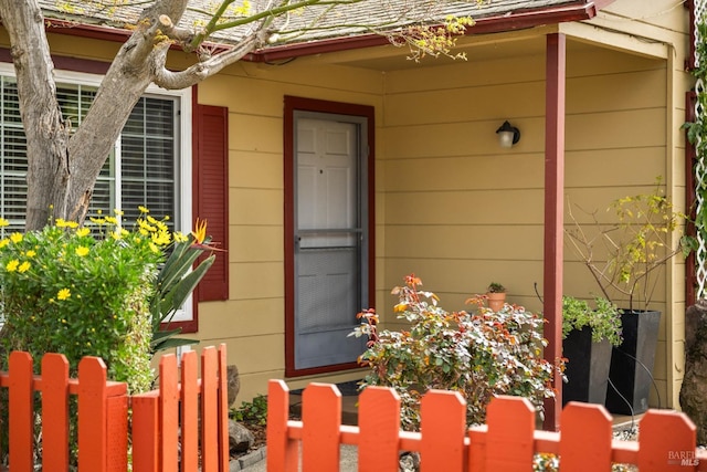 property entrance with fence