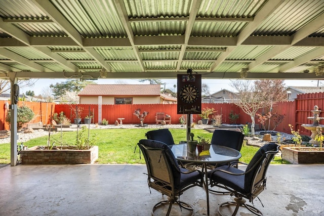view of patio featuring a fenced backyard and outdoor dining space