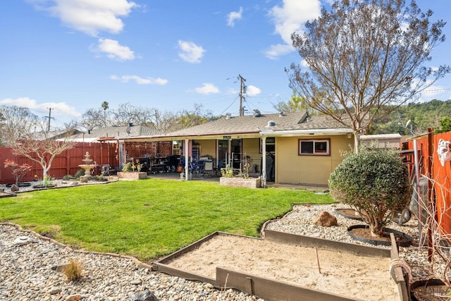 back of property with a patio area, stucco siding, fence, and a lawn