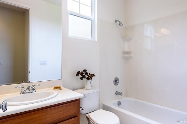 bathroom with toilet, shower / washtub combination, and vanity