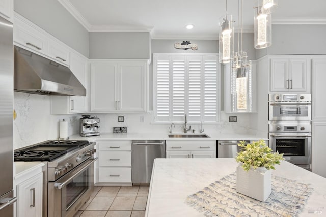 kitchen featuring appliances with stainless steel finishes, light countertops, and under cabinet range hood