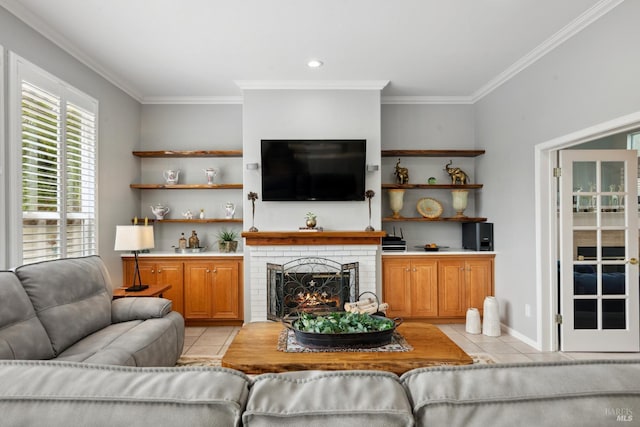 living room with light tile patterned floors, ornamental molding, and a brick fireplace