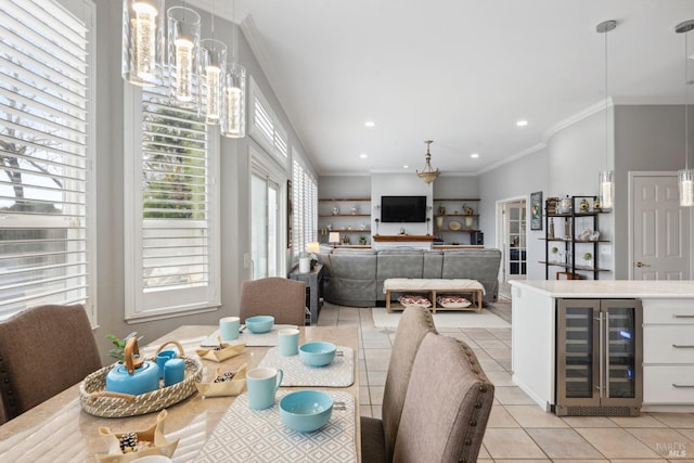 dining area featuring beverage cooler, light tile patterned floors, recessed lighting, and crown molding