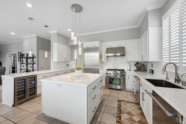 kitchen with a kitchen island, a sink, high quality appliances, beverage cooler, and under cabinet range hood