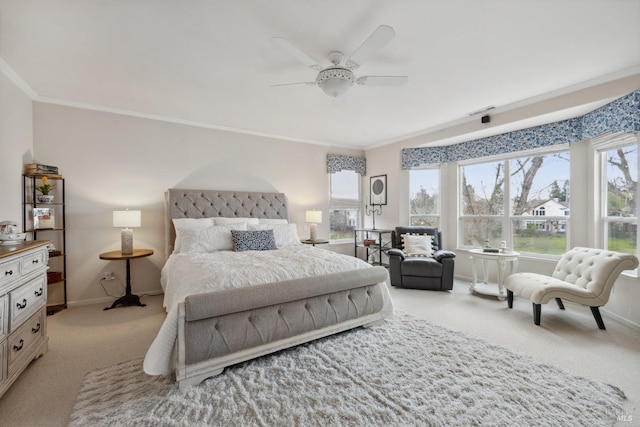 bedroom with ornamental molding, light colored carpet, baseboards, and multiple windows