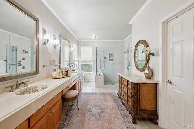 bathroom with double vanity, ornamental molding, a sink, a shower stall, and tile patterned flooring