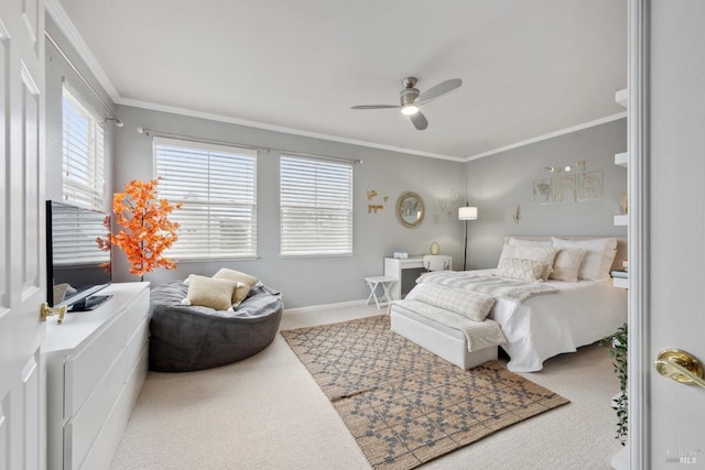 bedroom featuring baseboards, ornamental molding, a ceiling fan, and light colored carpet