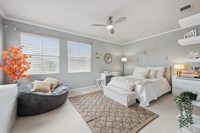 bedroom with visible vents, baseboards, a ceiling fan, crown molding, and carpet flooring