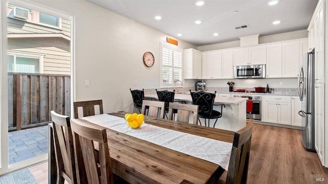 1623 Winterberry Ln, Rohnert Park, CA 94928 - dining room featuring light wood-style flooring and recessed lighting