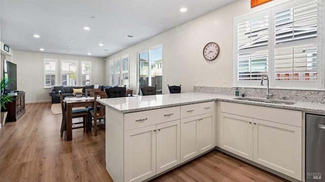 1623 Winterberry Ln, Rohnert Park, CA 94928 - kitchen featuring a sink, stainless steel dishwasher, wood finished floors, a peninsula, and recessed lighting