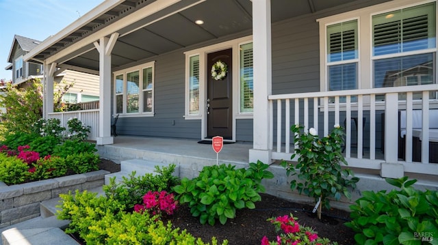 doorway to property featuring covered porch