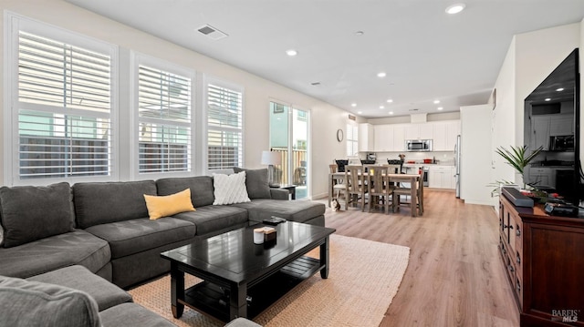 1623 Winterberry Ln, Rohnert Park, CA 94928 - living area featuring light wood-style floors, recessed lighting, and baseboards