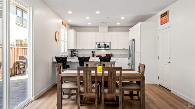 1623 Winterberry Ln, Rohnert Park, CA 94928 - dining area featuring light wood-style floors, recessed lighting, and baseboards