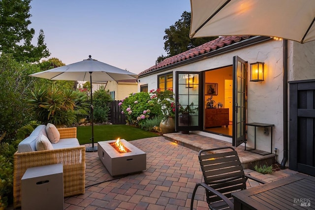 view of patio with a fire pit