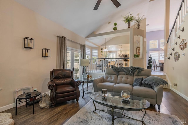 living area featuring lofted ceiling, dark wood-style floors, ceiling fan, and baseboards