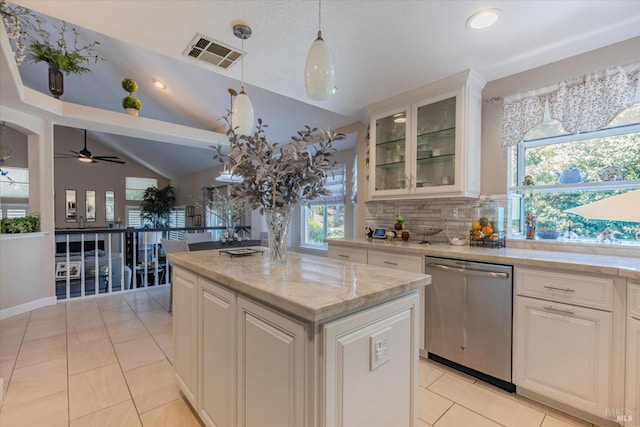 kitchen featuring visible vents, glass insert cabinets, white cabinets, a kitchen island, and dishwasher