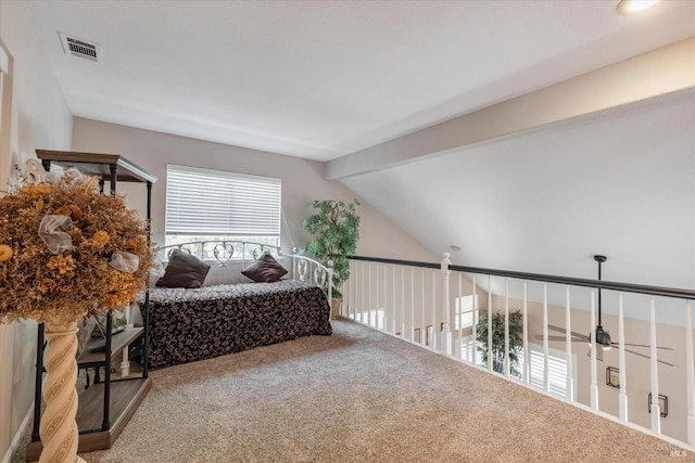 bedroom with lofted ceiling with beams, visible vents, and carpet flooring