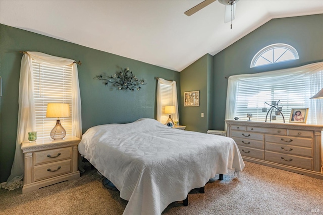 bedroom with light carpet, vaulted ceiling, and ceiling fan