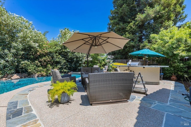 view of patio with an outdoor pool, an outdoor hangout area, and outdoor dry bar