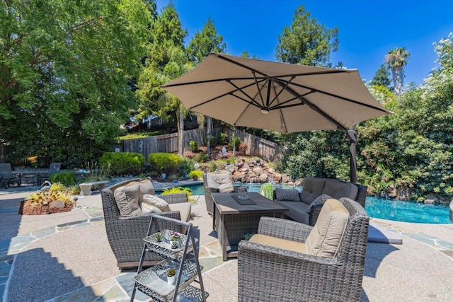 view of patio / terrace with a fenced backyard, an outdoor living space, and an outdoor pool