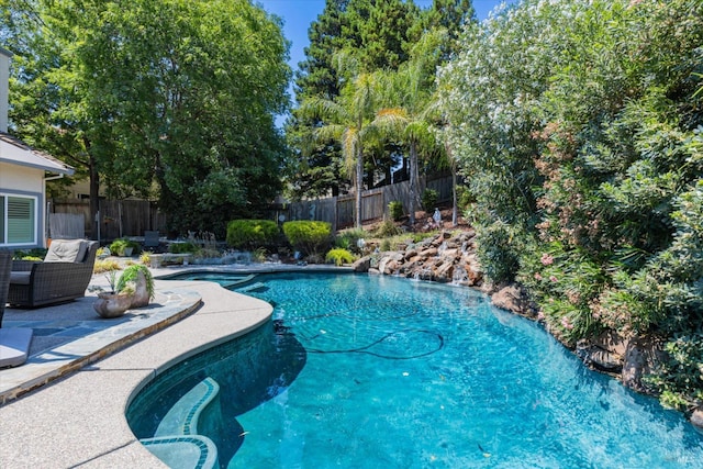 view of pool featuring a fenced in pool, a patio area, and a fenced backyard