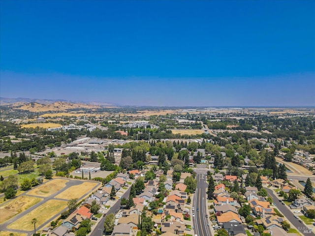 birds eye view of property featuring a mountain view and a residential view