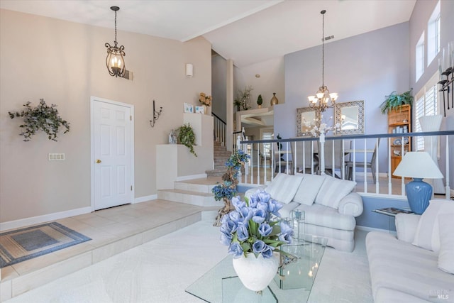 living area featuring baseboards, visible vents, stairway, high vaulted ceiling, and a notable chandelier