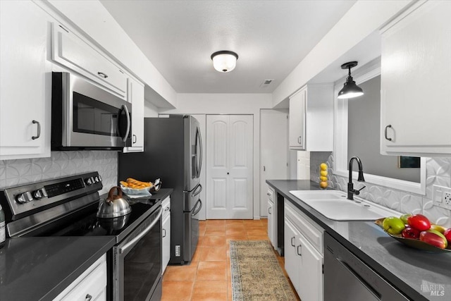 bathroom with toilet, baseboards, wood finished floors, and vanity