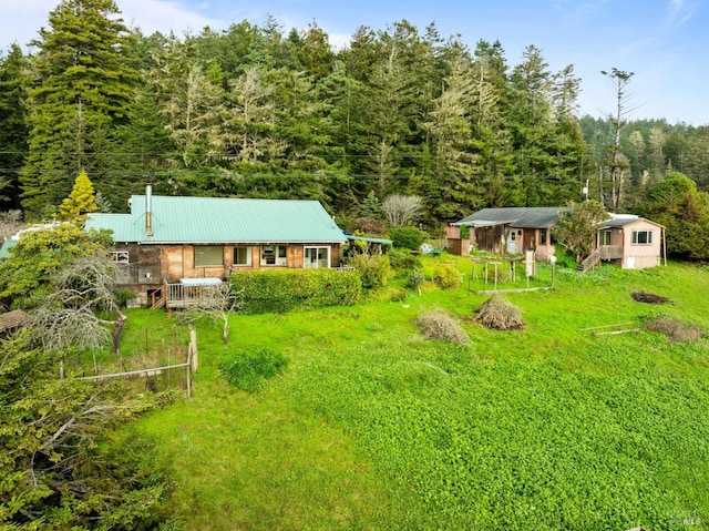 view of yard with a forest view