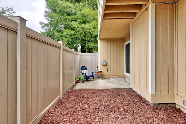 view of yard with a patio and a fenced backyard