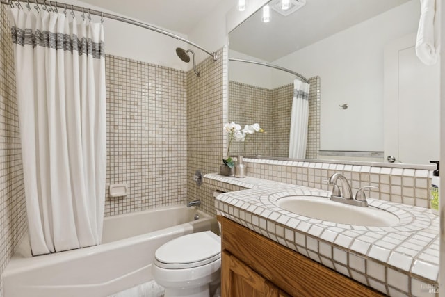 full bathroom featuring shower / bath combo, vanity, and toilet