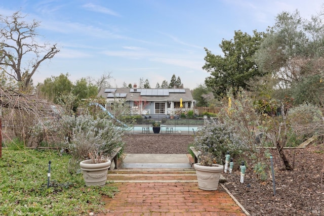 exterior space with fence and a fenced in pool