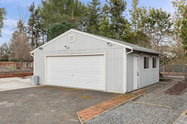 detached garage with fence