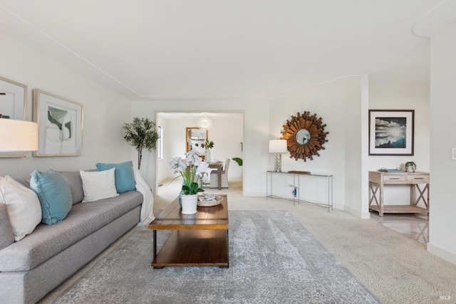 carpeted living area with baseboards