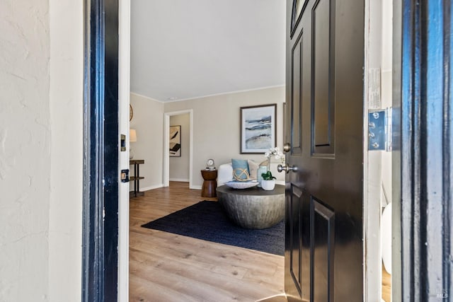 foyer featuring light wood-type flooring and baseboards